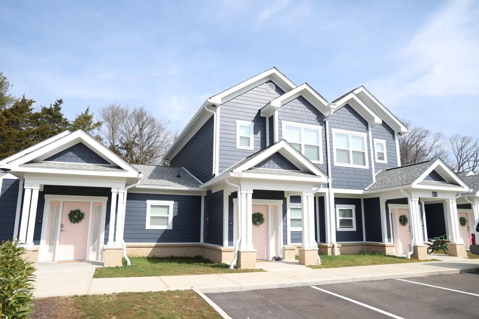 Navy lap siding, white trim and gutters at Helen Ross